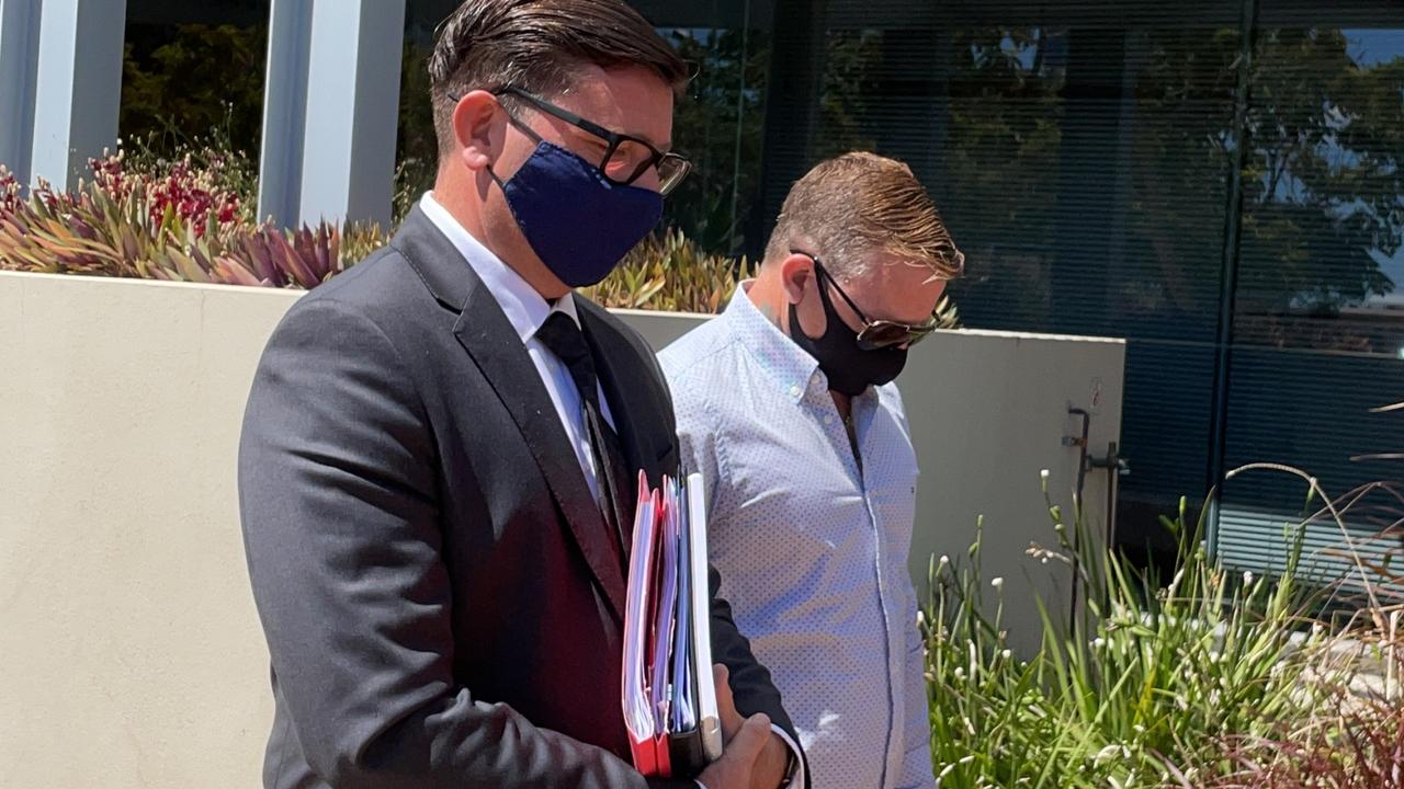 Mitchell Anthony Ralston (right) leaves Southport Court with his lawyer Michael Gatenby, of Gatenby Criminal Lawyers during his 2021 cabbie bashing matter.. Picture: Lea Emery