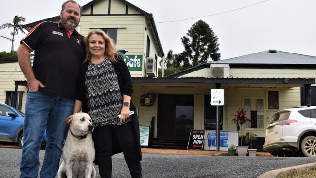 Eungella General Store owners Jamie Mussig and Michaela Pritchard with their shop pets, Tully the dog and Sammy aka Chookie the ringneck parrot, wanted to thank the community for all of their support. Picture: Heidi Petith