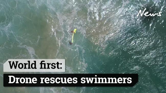 World first: Incredible moment drone saves two swimmers' lives