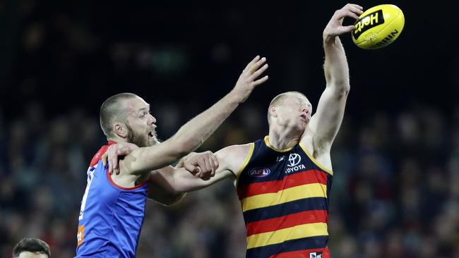 Sam Jacobs wins the tap against Max Gawn. Picture: Sarah Reed