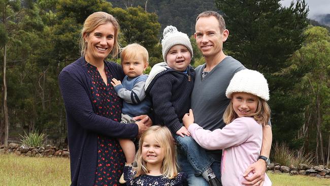 Emily holding Gilbert 1 with Eleanor 3, Ned 6 with dad Seth and Lucy 9. Ned Isham is back home in Hobart after a long year of treatment both in Australia and the United States. Ned is now cancer free and continuing his recovery at home with his family. Picture: NIKKI DAVIS-JONES