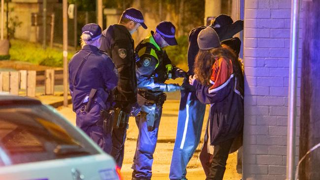 Police question youths following an incident. Photo: Damian Hoffman