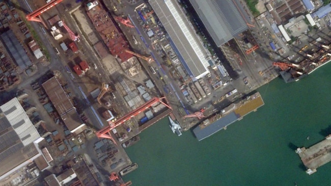 A satellite image of Guangzhou Shipyard International taken on October 23, 2024, shows what looks to be a new class of ship with a large flight deck. Picture: Planet Labs Inc