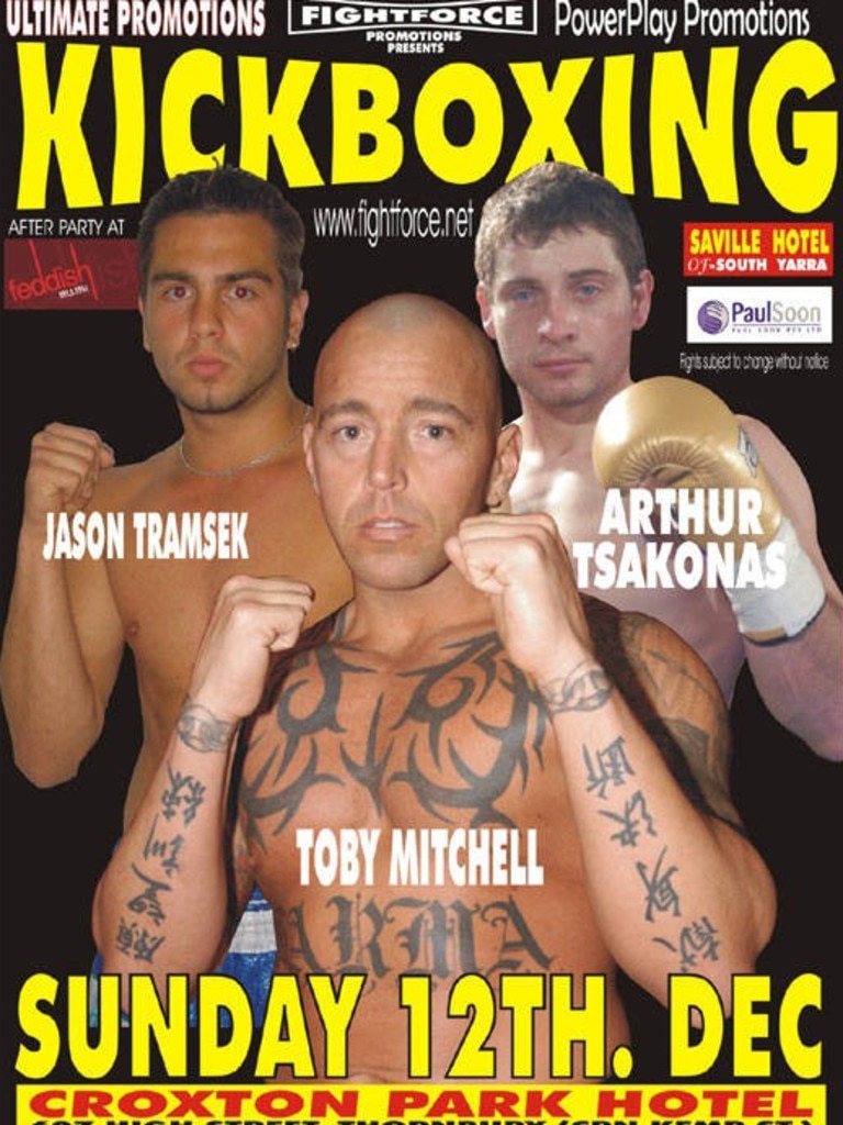 Mitchell showing off his chest tattoos on the cover of Kickboxing magazine.