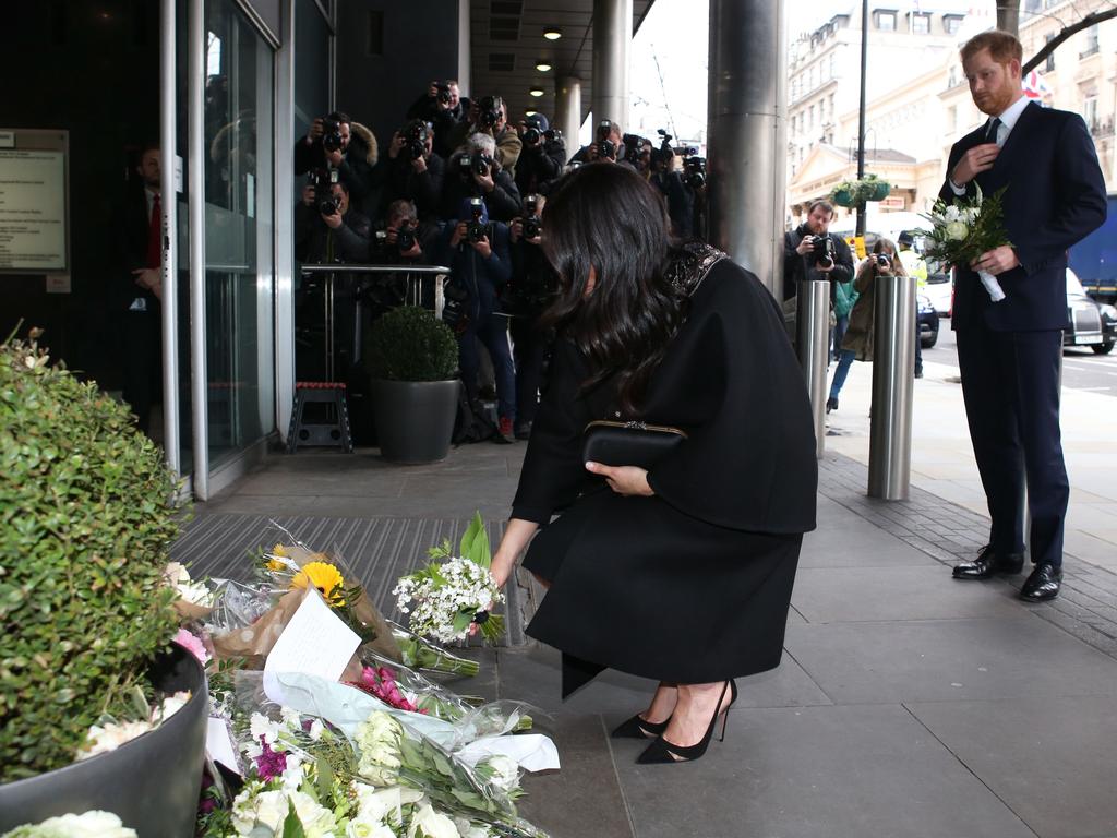 The Duke and Duchess of Sussex add bouquets of flowers to a pile of floral tributes at the New Zealand High Commission in London. Picture: AFP