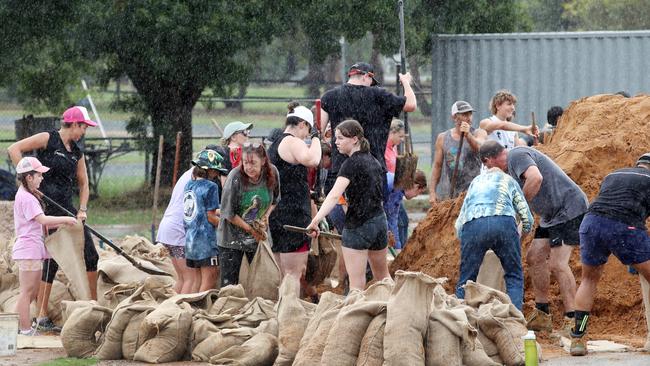 Locals fill sand bags in Rochester. Picture: David Crosling