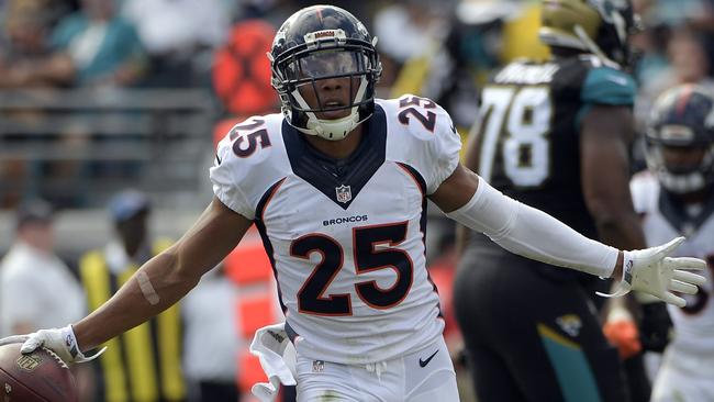 Denver Broncos cornerback Chris Harris (25) celebrates after intercepting a pass.