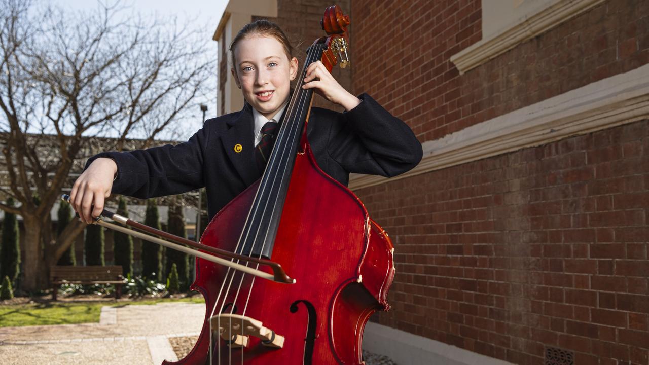 Charlotte Ryall with her double-bass after competing in the All-Age graded string solo preliminary section of the 78th City of Toowoomba Eisteddfod at The Empire, Friday, July 26, 2024. Picture: Kevin Farmer