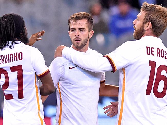 Roma’s Miralem Pjanic celebrates scoring against Manchester City.