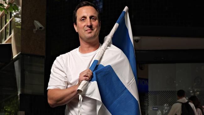 Mark Spiro with his Israeli flag. Picture: Adam Yip