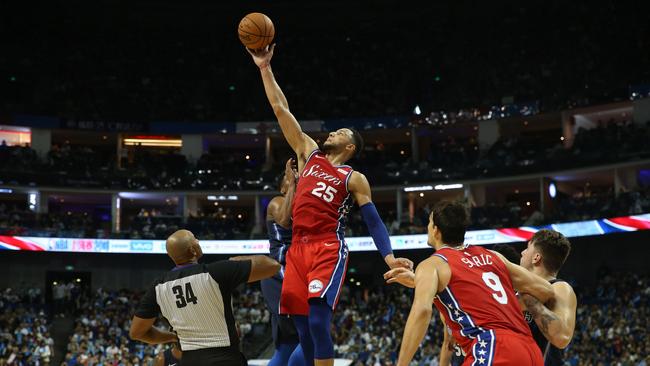 Ben Simmons (C) of the Philadelphia 76ers goes up for the ball during the preseason NBA basketball game between the the Philadelphia 76ers and the Dallas Mavericks. Picture: AFP