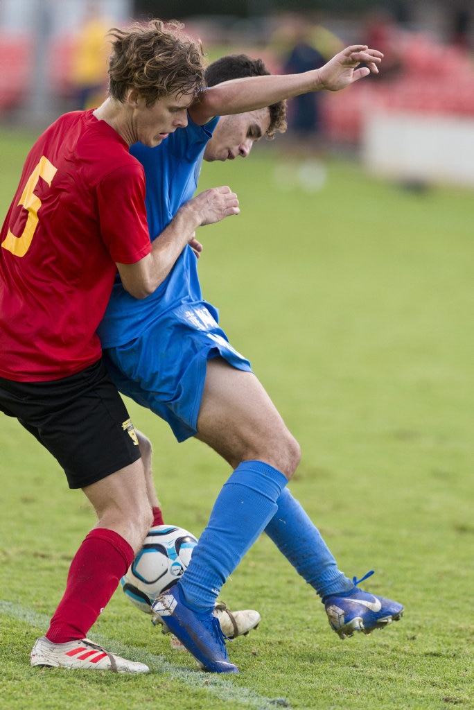 Tyler Morse (left) of Sunshine Coast Fire tackles Keanu Tuart of South West Queensland Thunder in NPL Queensland men round nine football at Clive Berghofer Stadium, Saturday, March 30, 2019. Picture: Kevin Farmer