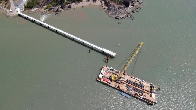 A crane barge is still erecting new pylons for the 165m jetty. Picture: Brendan Radke