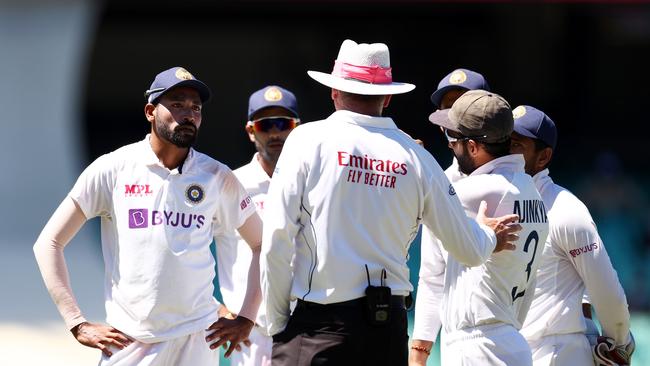 SYDNEY, AUSTRALIA – JANUARY 10: Mohammed Siraj of India stops play to make a formal complaint about some spectators in the bay behind his fielding position during day four of the Third Test match in the series between Australia and India at Sydney Cricket Ground on January 10, 2021 in Sydney, Australia. (Photo by Cameron Spencer/Getty Images)