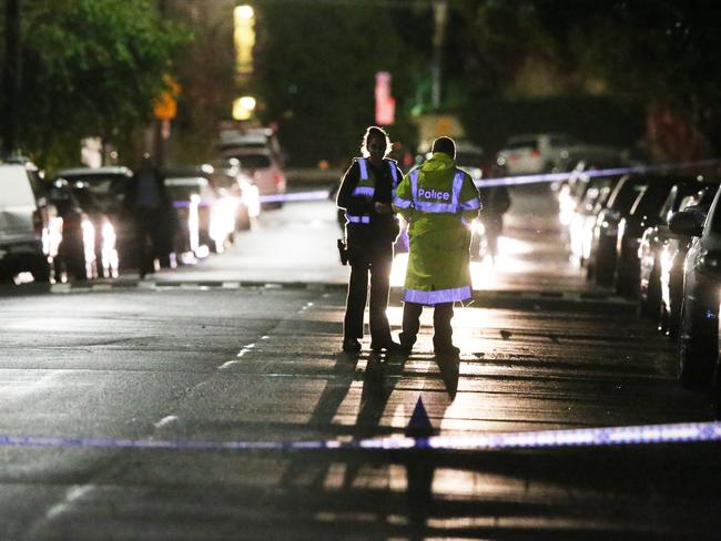 Police on the street in Westbank Terrace, Richmond. Picture: David Crosling