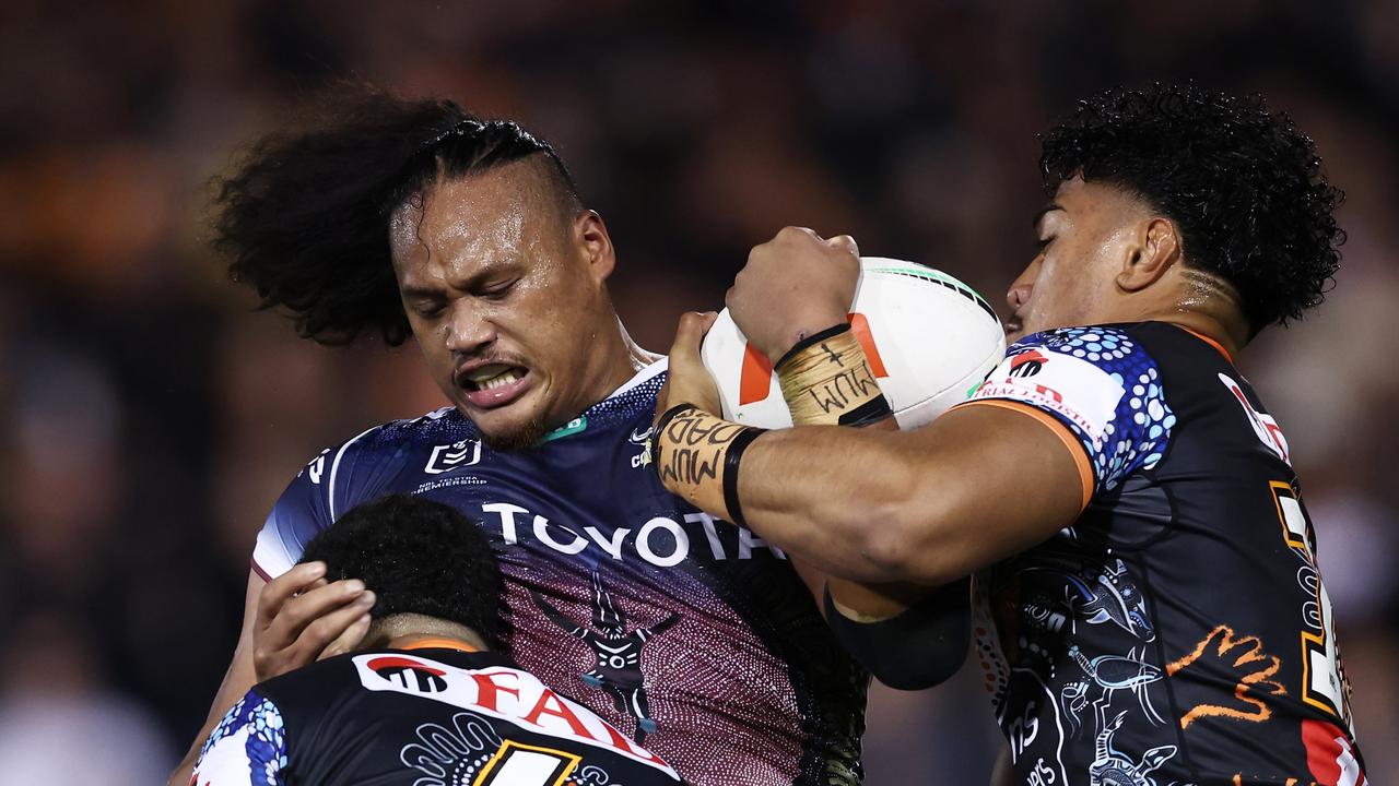 SYDNEY, AUSTRALIA - MAY 20: Luciano Leilua of the Cowboys is tackled during the round 12 NRL match between Wests Tigers and North Queensland Cowboys at Leichhardt Oval on May 20, 2023 in Sydney, Australia. (Photo by Matt King/Getty Images)