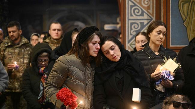 Close relatives and friends attend the funeral of Ukrainian serviceman Sergii Myronov during a ceremony at the St. Michael's Golden-Domed Cathedral in Kyiv.