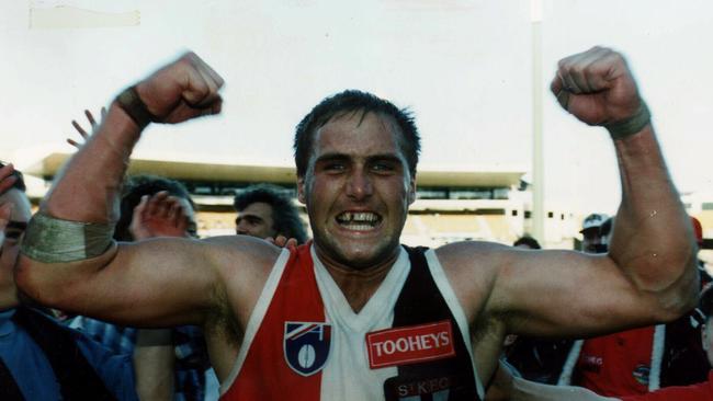 Tony Lockett celebrates his 11-goal haul against the Swans in 1994.