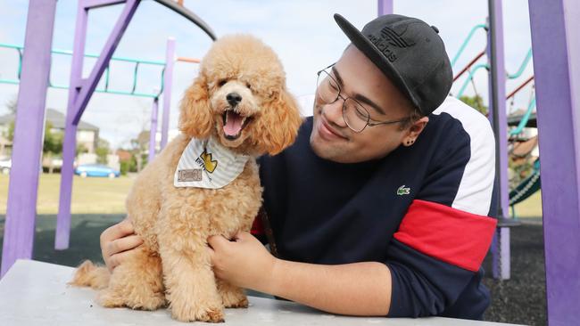 Pictured at their home in St.Mary's in Sydney is Patrick Gaerlan with his dog Theo.Petbarn is providing free deliveries to healthcare workers, the elderly and those who are isolating due to COVID-19. Picture: Richard Dobson