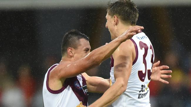 Zac Bailey jumps for joy on his way to a record-equalling goal haul in a Q-clash. Picture: Matt Roberts/AFL Photos/Getty Images