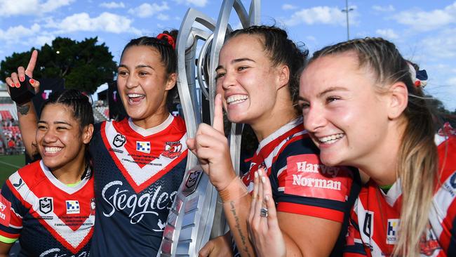 Simone Karpani, Corban Baxter, Isabelle Kelly and Brydie Parker celebrate after inning last year’s NRLW grand final. Picture: Albert Perez/Getty Images