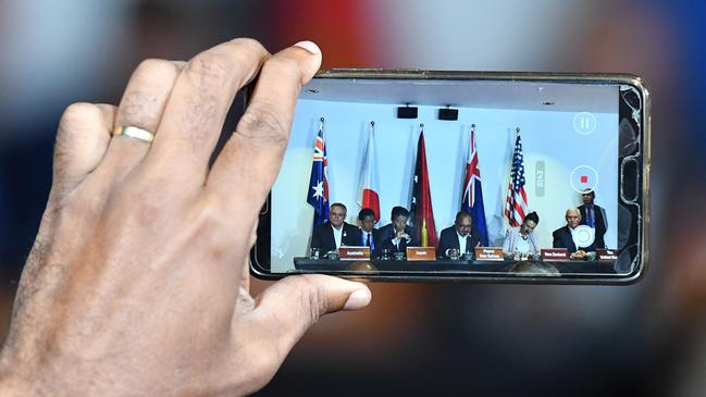 Australia's Prime Minister Scott Morrison, Japan's former Prime Minister Shinzo Abe, Papua New Guinea’s former Prime Minister Peter O'Neill, New Zealand's Prime Minister Jacinda Ardern and United States former Vice President Mike Pence at an APEC meeting in Port Moresby in 2018.