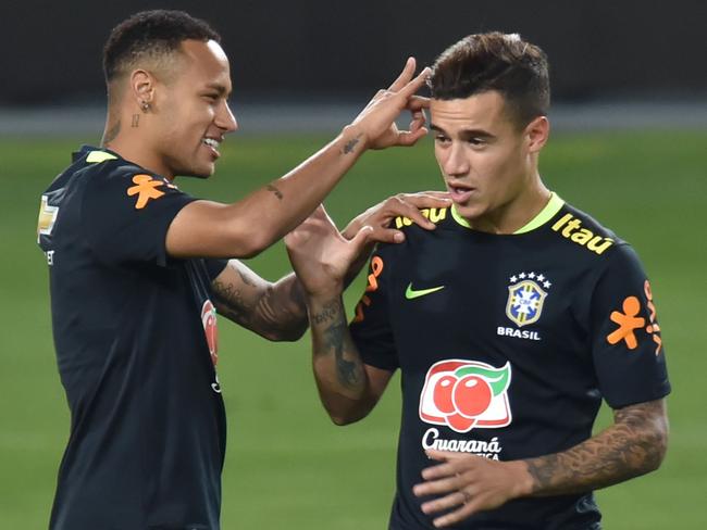 Neymar (L) and Philippe Coutinho. / AFP PHOTO / LUKA GONZALES