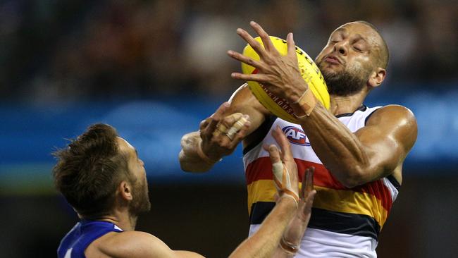 Cam Ellis-Yolmen takes a mark under pressure from Jamie Macmillan of the Kangaroos. Picture: AAP Image/Hamish Blair