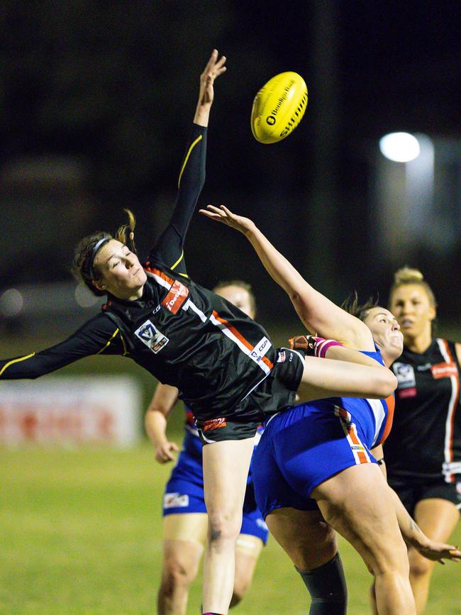 Kate Oborn taps the ball for Frankston. Picture: Alan Dillon