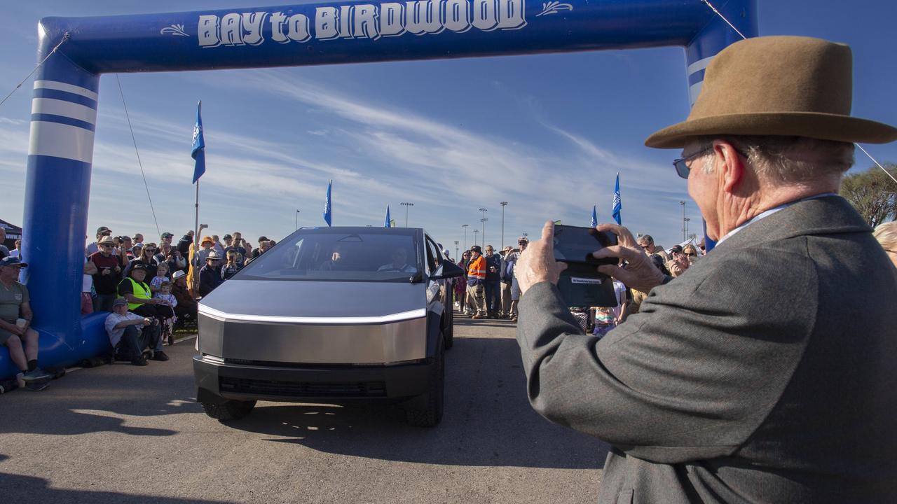 Tesla Cybertruck draws a big crowd. Keith Williamson 75 from Hawthorndene gets a pic. Picture: Brett Hartwig