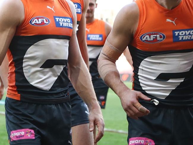 SYDNEY, AUSTRALIA - AUGUST 17: Giants players celebrate victory following the round 23 AFL match between Greater Western Sydney Giants and Fremantle Dockers at ENGIE Stadium on August 17, 2024 in Sydney, Australia. (Photo by Jason McCawley/AFL Photos/via Getty Images)