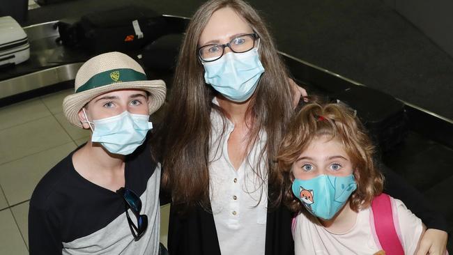 Naomi Lucas Smith with son Kai and daughter Mia arrive back in Melbourne after COVID border restrictions were eased. Picture: David Crosling