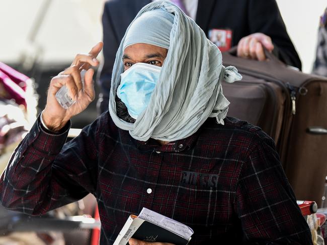 An Australian returns to Sydney Airport before going into quarantine. Picture: AAP