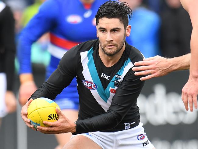 Josh Dunkley of the Bulldogs (left) and Chad Wingard of the Power (second from left) contest during the Round 19 AFL match between the Western Bulldogs and the Port Adelaide Power at Mars Stadium in Ballarat, Sunday, July 29, 2018. (AAP Image/Julian Smith) NO ARCHIVING, EDITORIAL USE ONLY