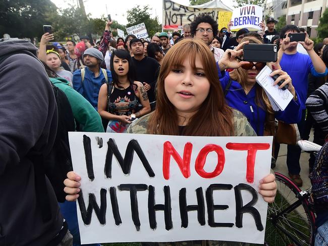 Protesters from Latino and Community groups make their way to East Los Angeles College in Monterey Park, California. Picture: AFP