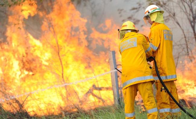 A generic image of fire fighters fighting a vegetation fire. A grass fire along North Deep Creek Rd is throwing up a lot of smoke, prompting warnings for drivers in the area. Picture: Brenda Strong