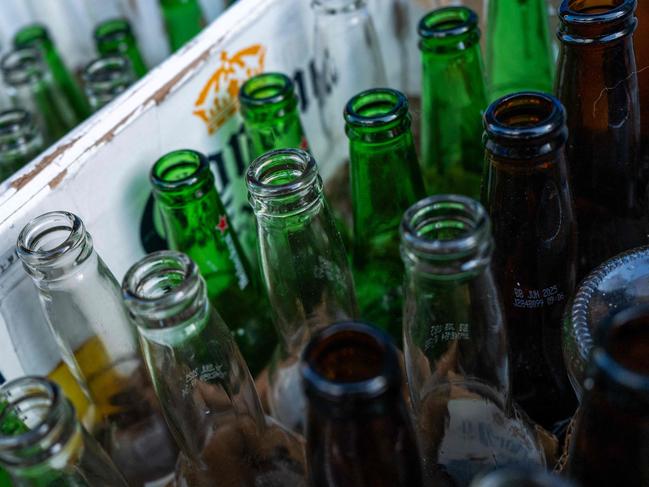 NEW YORK, NEW YORK - JANUARY 03: Boxes of empty beer bottles sit outside of a store in Brooklyn on January 03, 2025 in New York City. Surgeon General Dr. Vivek Murthy issued a new advisory on Friday that alcohol consumption can increase cancer risk and called for new and updated health warning label on alcoholic beverages.   Spencer Platt/Getty Images/AFP (Photo by SPENCER PLATT / GETTY IMAGES NORTH AMERICA / Getty Images via AFP)