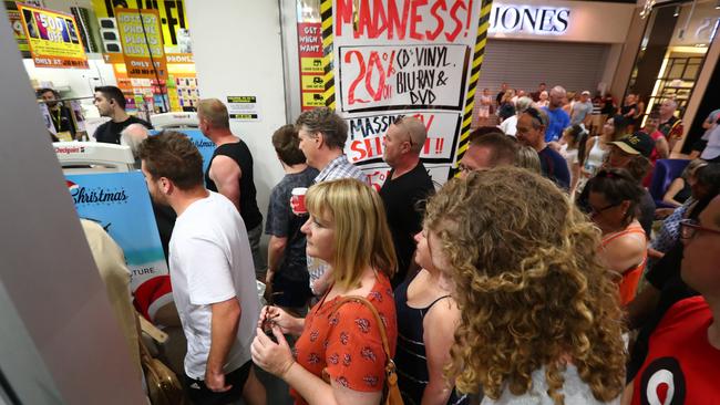 A crowd of shoppers head in to JB HiFi at Westfield Marion for the Boxing Day sales, the first time the centre has opened on Boxing Day. Picture: Tait Schmaal