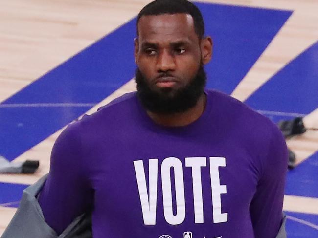 (FILES) In this file photo LeBron James #23 of the Los Angeles Lakers wears a VOTE shirt during warm-up prior to the start of the game against the Miami Heat in Game Five of the 2020 NBA Finals at AdventHealth Arena at the ESPN Wide World Of Sports Complex on October 9, 2020 in Lake Buena Vista, Florida. - Los Angeles Lakers star LeBron James teased the prospect of a possible bid for the WNBA's Atlanta Dream on January 6, 2021 after co-owner Kelly Loeffler's election defeat. Loeffler, the Republican politician who lost her US Senate run-off election in Georgia on Tuesday, is deeply unpopular amongst Dream players after voicing opposition to the Black Lives Matter movement last year. (Photo by SAM GREENWOOD / GETTY IMAGES NORTH AMERICA / AFP)