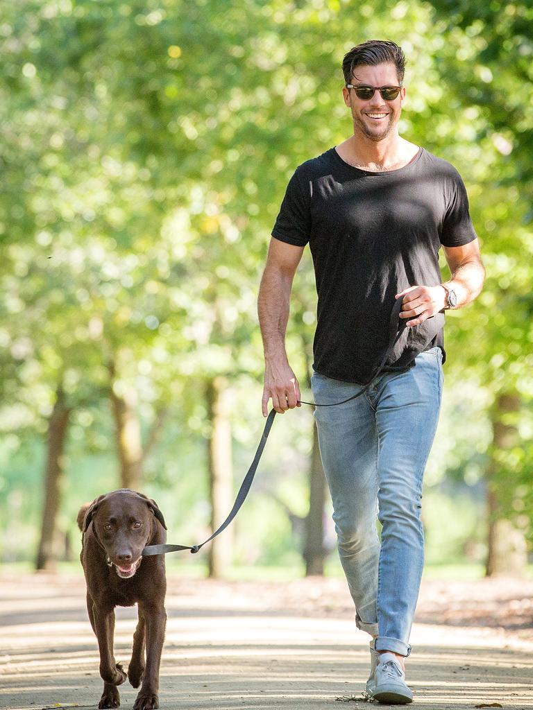 Fitness trainer Sam Wood walking his dog Hendrix. Picture: Mark Stewart