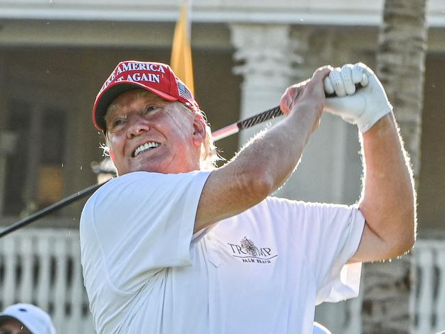 TOPSHOT - Former US President Donald Trump tees off during a visit a day ahead of the 2022 LIV Golf Invitational Miami at Trump National Doral Miami golf club on October 27, 2022 in Miami, Florida. (Photo by Giorgio VIERA / AFP)