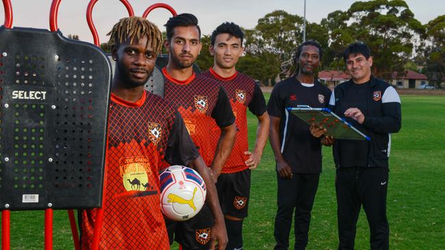 Ghan Kilburn City players Lyon Varney, Masoud Teymouri, Javeed Zamini with assistant coach Desmond Tucker and coach Rahim Zaidi. Picture: AAP Image/ Brenton Edwards