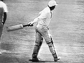 Dennis Lillee’s assumes the position for his world record aluminium bat throw.