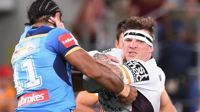 Josh McGuire on the charge for the Broncos against the Titans.