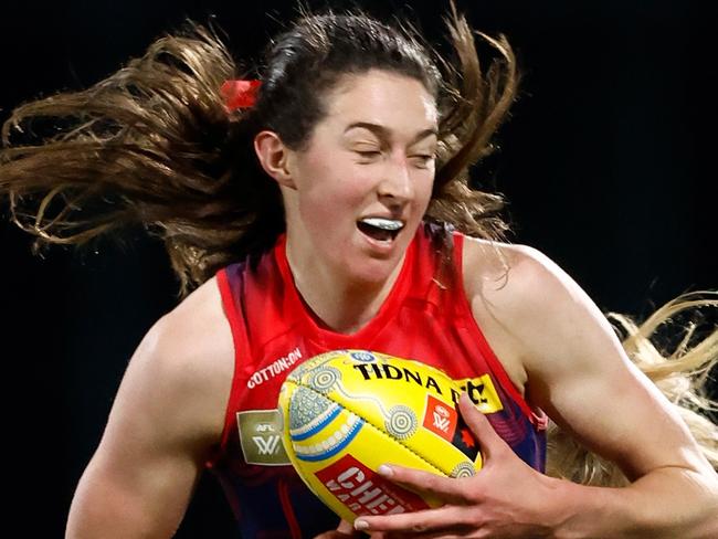 MELBOURNE, AUSTRALIA - OCTOBER 21: Alyssa Bannan of the Demons is tackled by Lulu Pullar of the Kangaroos during the 2023 AFLW Round 08 match between Narrm (The Melbourne Demons) and The North Melbourne Tasmanian Kangaroos at IKON Park on October 21, 2023 in Melbourne, Australia. (Photo by Michael Willson/AFL Photos via Getty Images)