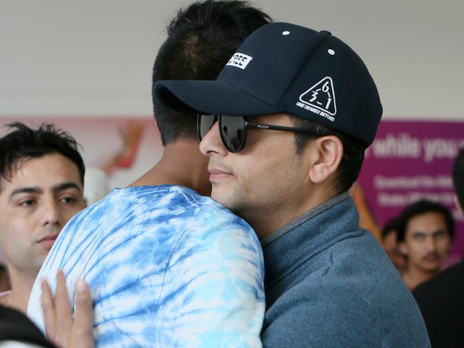 The elder Brother of Nepalese migrant Nischal Ghimire 22yrs - who drowned on Friday the 28th of December 2018 - Ghanashyam Ghimire (with sunglasses) was greeted at Adelaide Airport by family, friends and community members, after flying in from Nepal. (AAP/Emma Brasier)