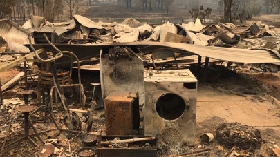 Jamie Zaia and Anita Reeves lost their home in the bushfires, when it burnt to the ground on November 8. They have now been caught up in a bushfire business grants scam, where a Belmont South man allegedly used their property to claim $50,000. Supplied.