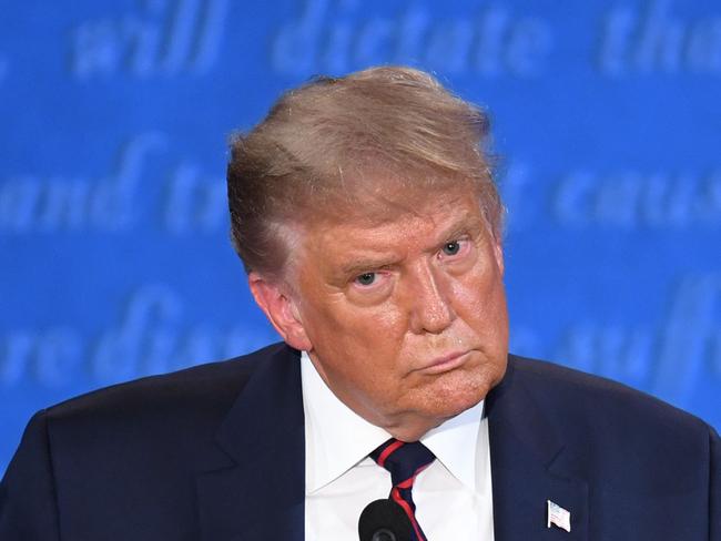 (FILES) In this file photo taken on September 29, 2020 US President Donald Trump speaks during the first presidential debate at Case Western Reserve University and Cleveland Clinic in Cleveland, Ohio. - Donald Trump had a positive Covid-19 test, quickly followed by a negative, shortly before he went into a presidential debate with challenger Joe Biden last year, according to a new book. Despite getting the all clear in that second test, Trump would get so sick with Covid-19 within a week that he had to be urgently hospitalized. The testing detail emerged December 1, 2021 in a report by The Guardian, which obtained an advance copy of "The Chief's Chief," a memoir by Trump's chief of staff at the time, Mark Meadows. (Photo by SAUL LOEB / AFP)