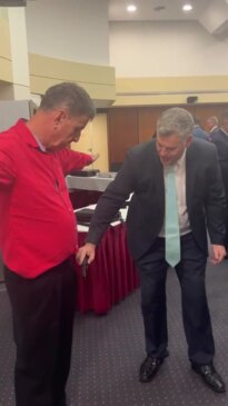 Mark Ryan uses police wand on Maryborough MP Bruce Saunders