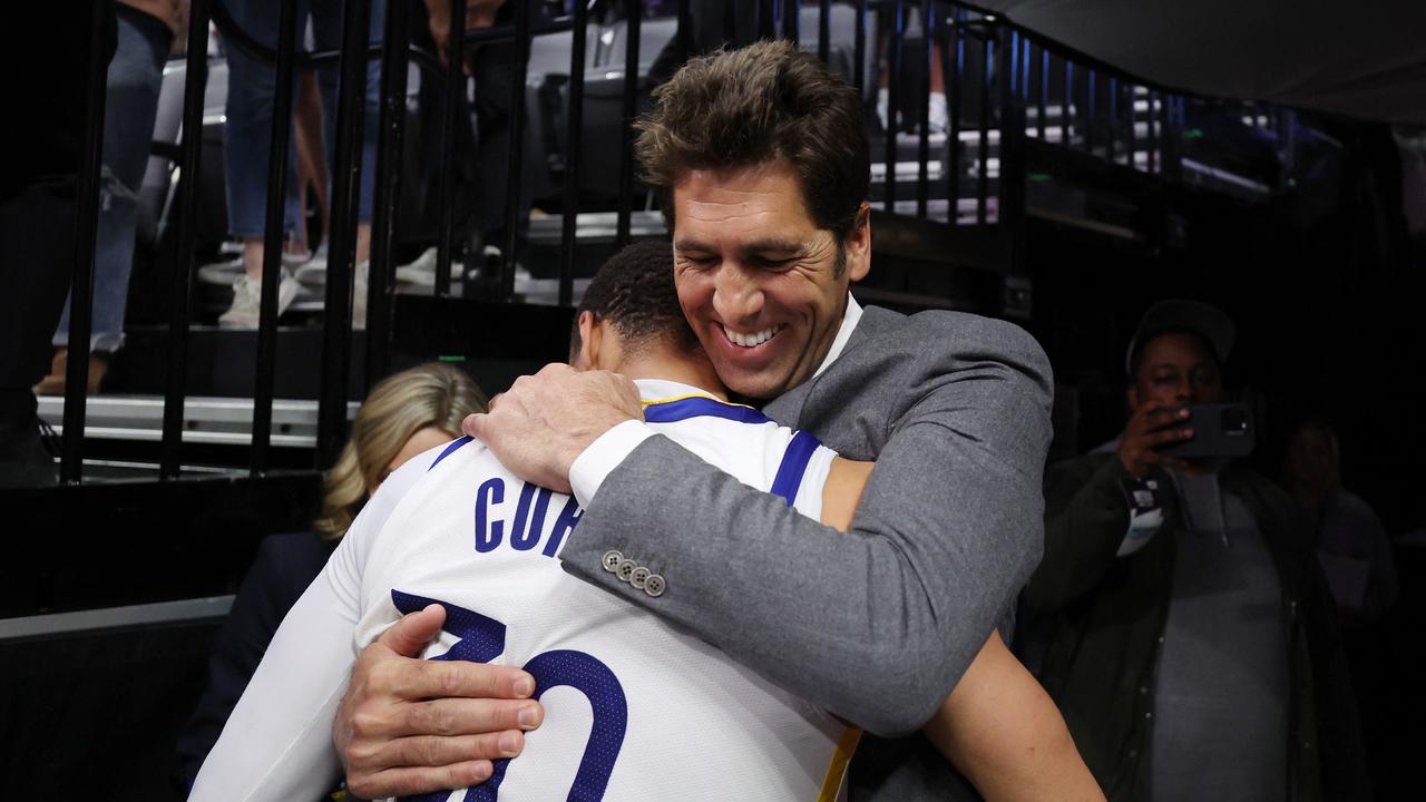 SACRAMENTO, CALIFORNIA - APRIL 30: Stephen Curry #30 of the Golden State Warriors hugs general manager Bob Myers after the Warriors defeated the Kings 120-100 in game seven of the Western Conference First Round Playoffs at Golden 1 Center on April 30, 2023 in Sacramento, California. NOTE TO USER: User expressly acknowledges and agrees that, by downloading and or using this photograph, User is consenting to the terms and conditions of the Getty Images License Agreement. Ezra Shaw/Getty Images/AFP (Photo by EZRA SHAW / GETTY IMAGES NORTH AMERICA / Getty Images via AFP)